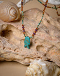 Turquoise fish with colorful neck stones
